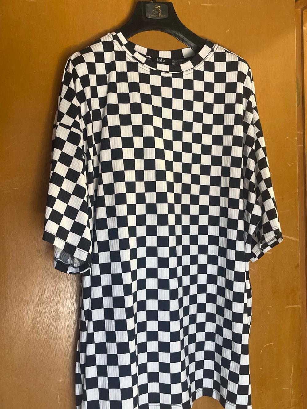 Dressed in LALA Black & White Checkered Short Sleeve Tee and shorts